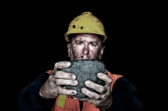Lump of coal underground miner